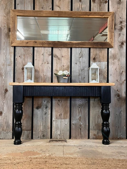Black upcycled pine console table with fluted oak detailing, styled with Boëme XL mirror above, handmade in France.