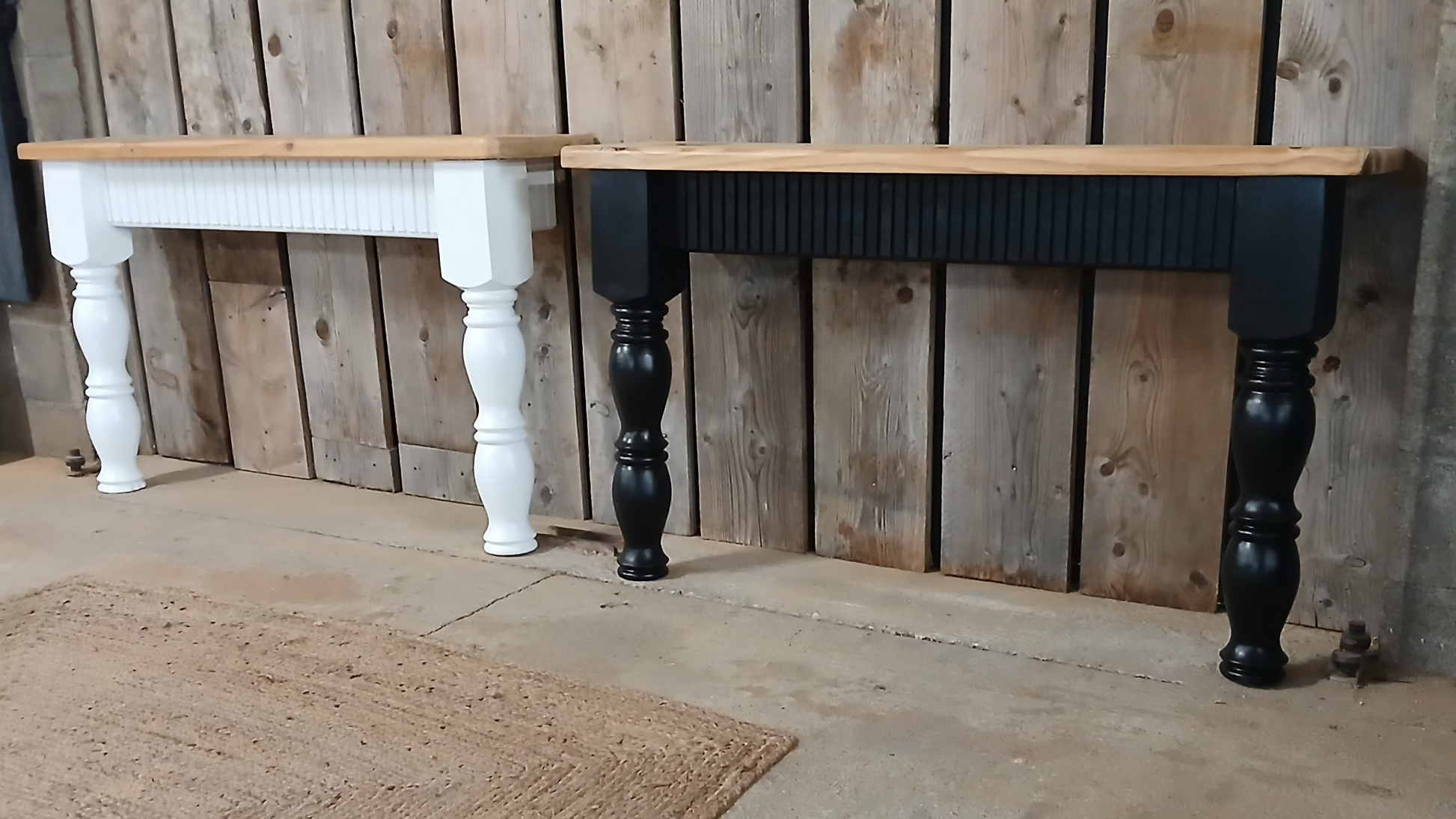 Black and white upcycled pine console tables side by side, showing fluted oak detailing and handcrafted farmhouse-style design, handmade in France.