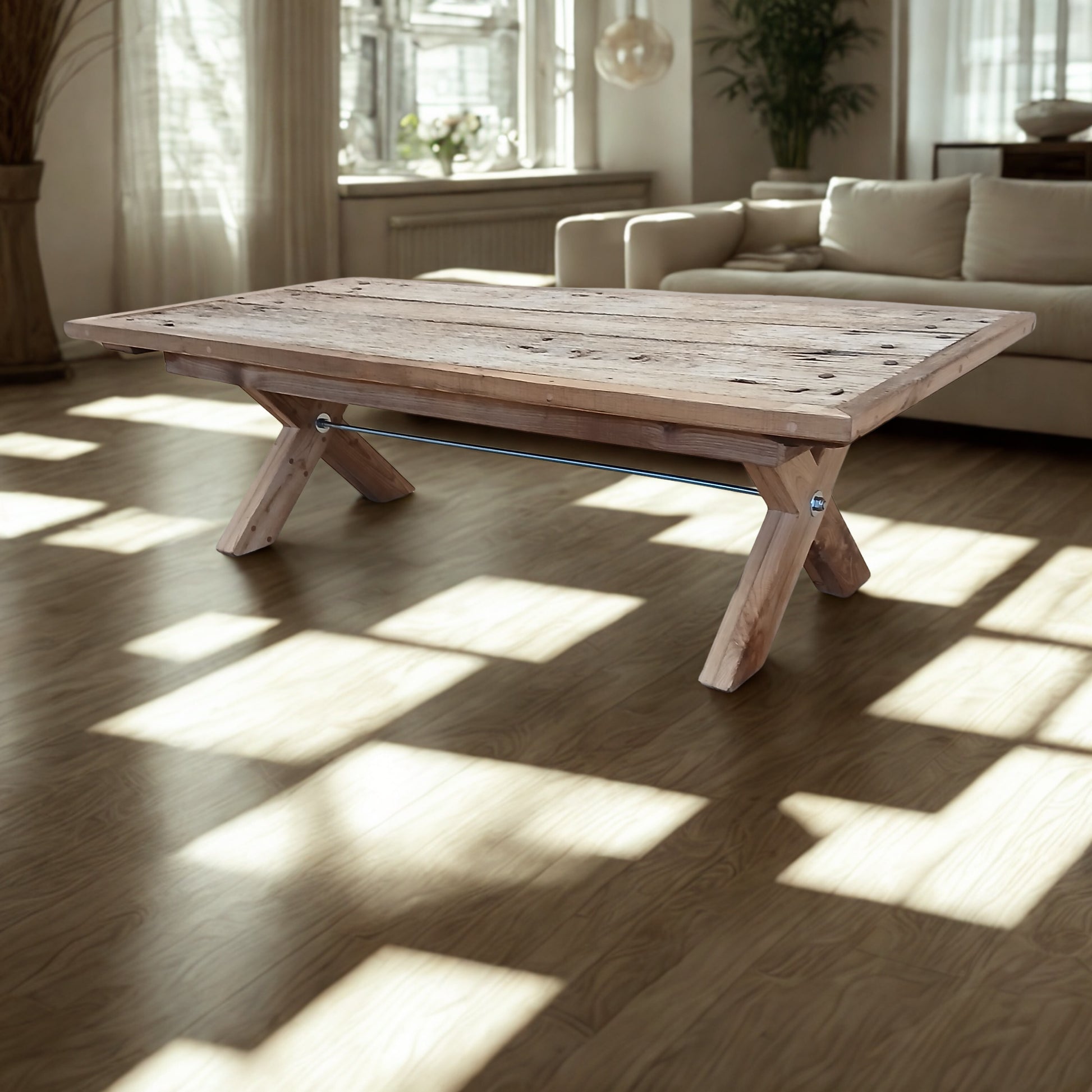Handcrafted solid French Oak coffee table made from reclaimed wood and recycled materials, set in a well-lit living room in soft, earthy colours.