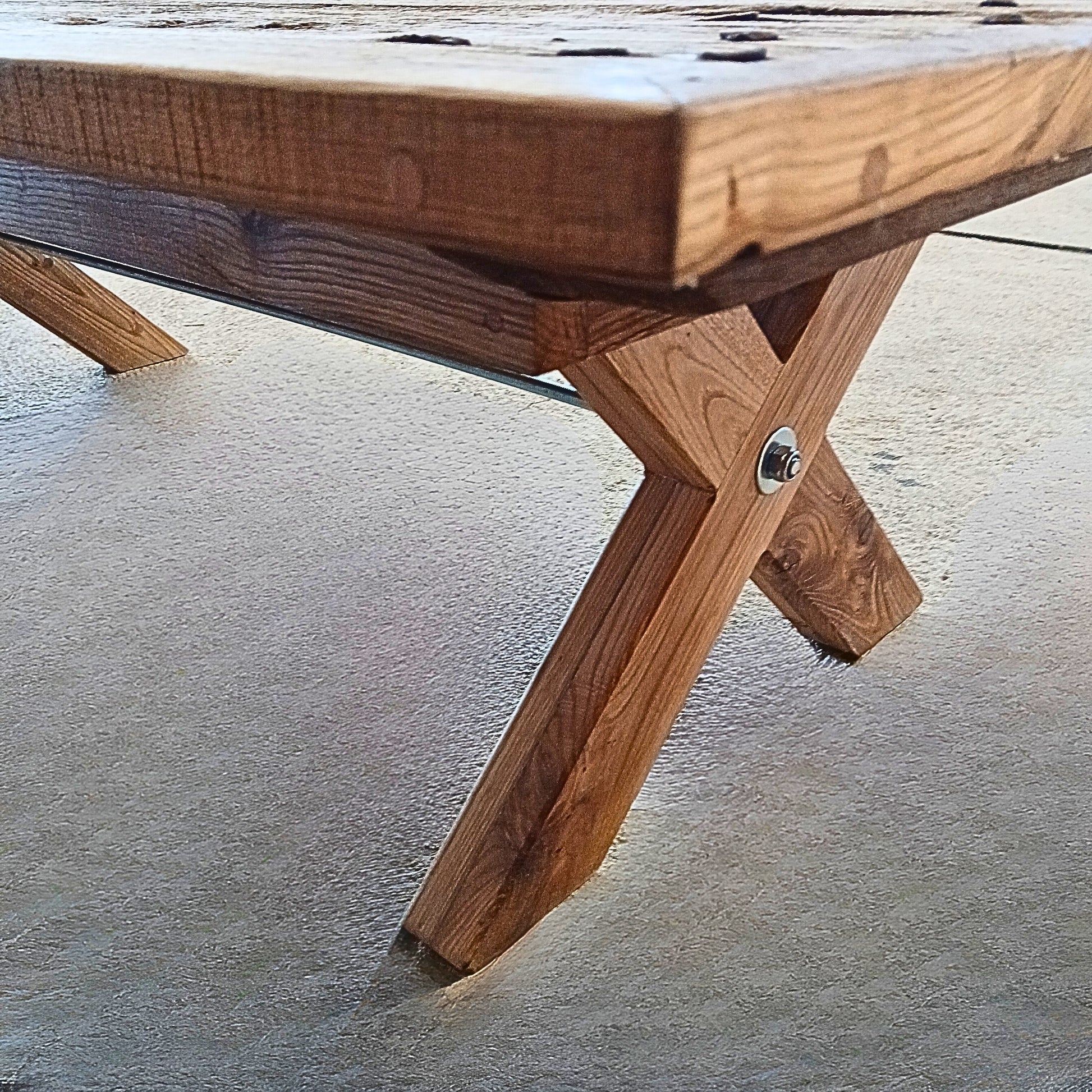 Solid French Oak coffee table with X-shaped legs handcrafted from reclaimed wood and recycled steel.