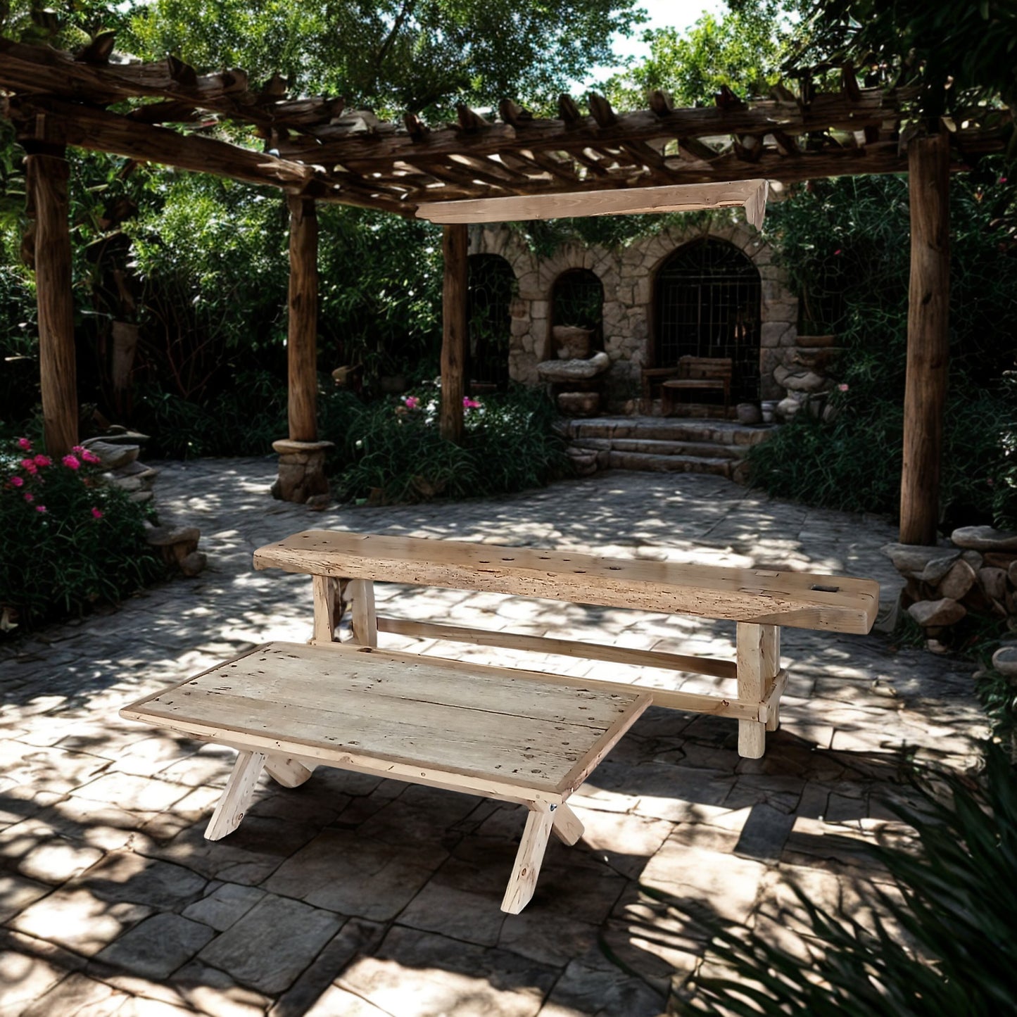 Lisonne coffee table and Charente console table under wooden pergola set in French Riviera style gardens with soft flagstone flooring and stone arches.
