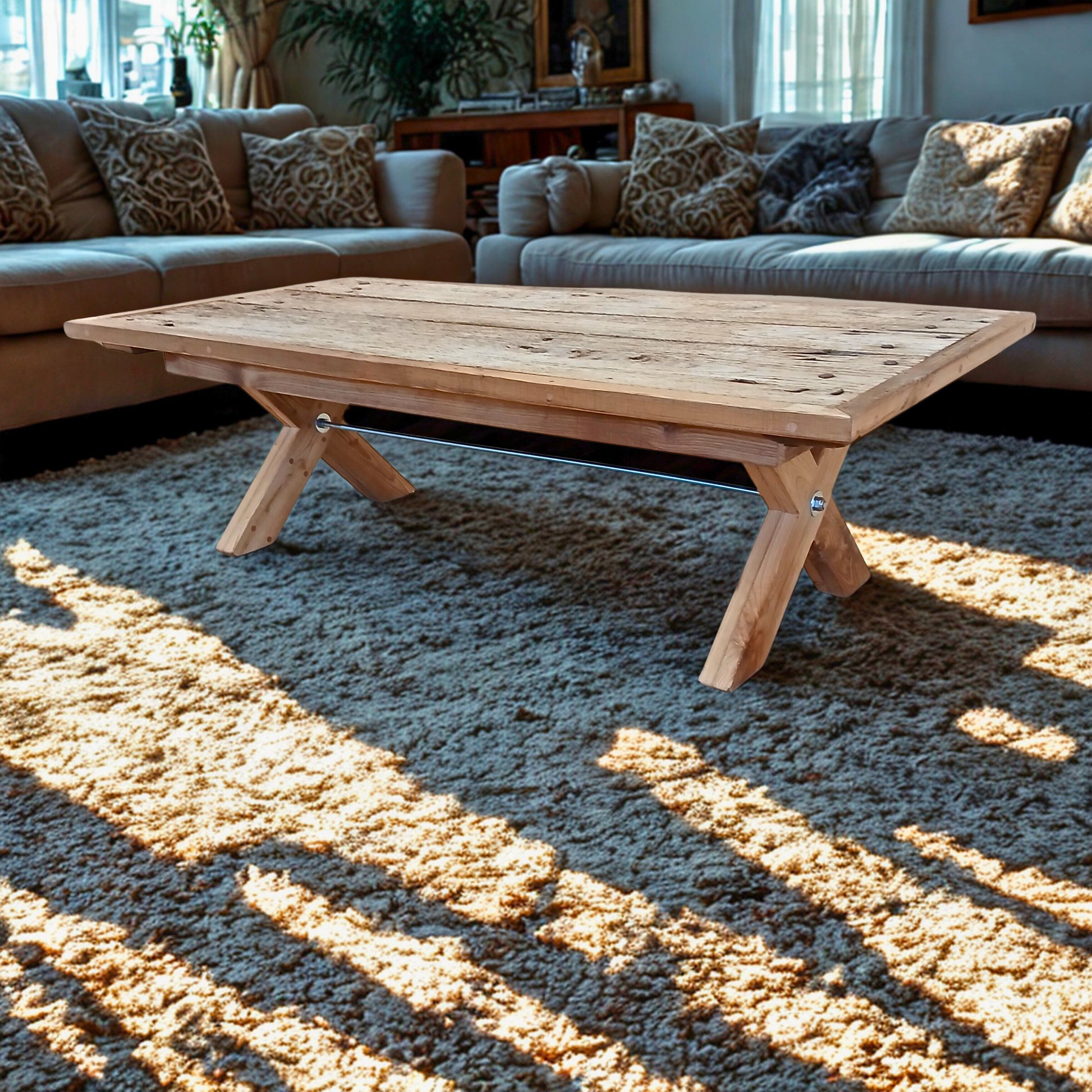 Handcrafted solid French Oak coffee table using reclaimed wood and recycled materials, set in a neutral themed Parisian style living room with natural lighting and soft furnishings.