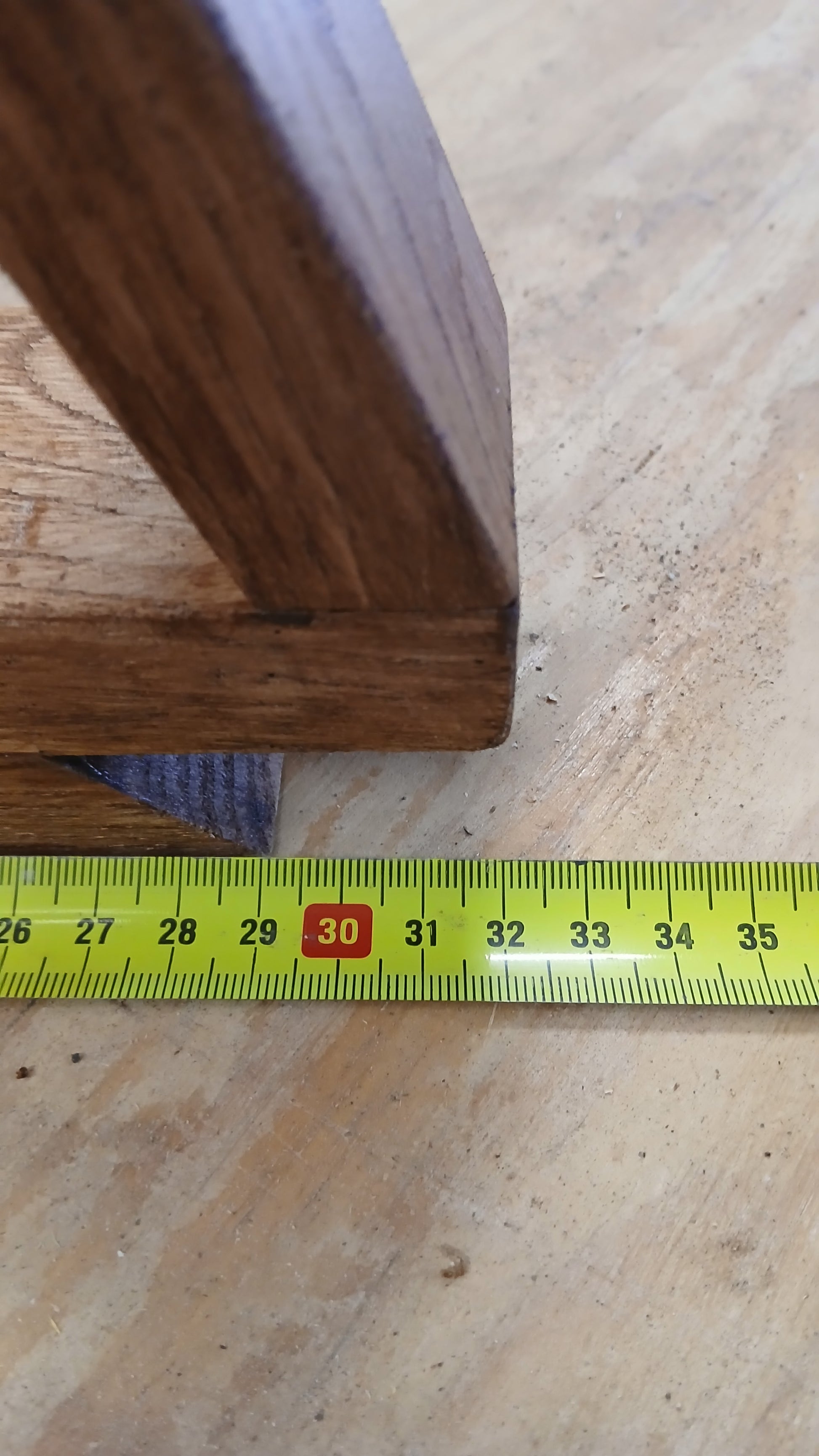 Photo showing the width of our chestnut Christmas tree from our festive decor collection in our workshop, measuring 32cm. 