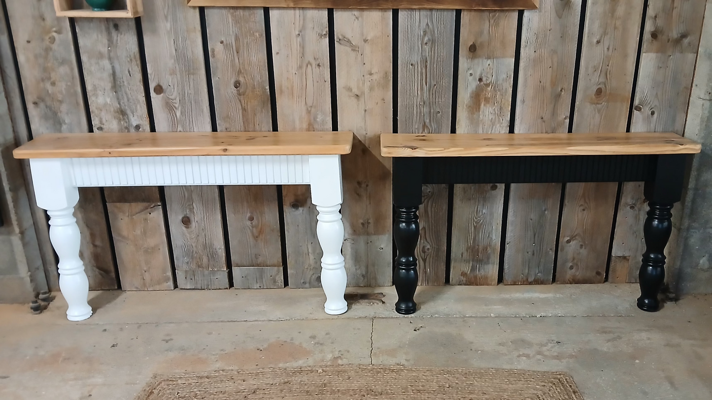 Wide view of black and white upcycled pine console tables showing fluted oak detailing and curved farmhouse-style legs, handmade in France.