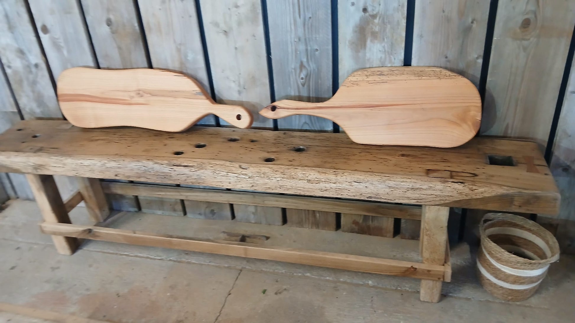 Front view of two French cherry wood charcuterie boards side by side, handmade in France. Also featuring Charente solid oak console table. 
